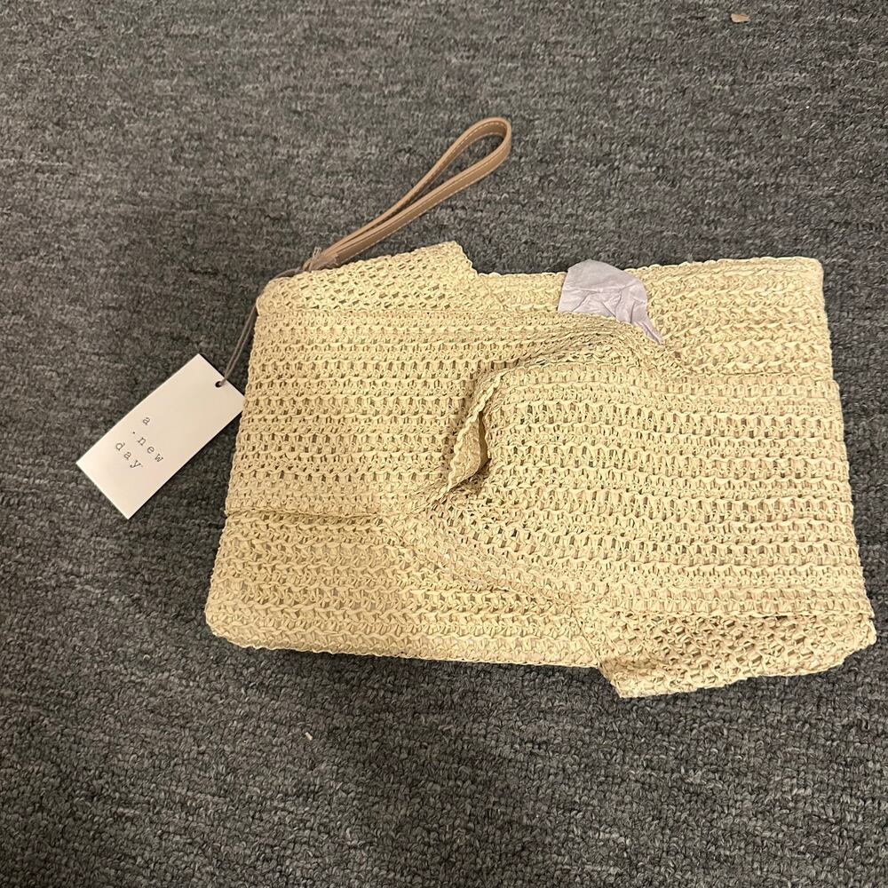 A New Day Beige Bow Clutch w/wristlet strap and zip closure/ NWT